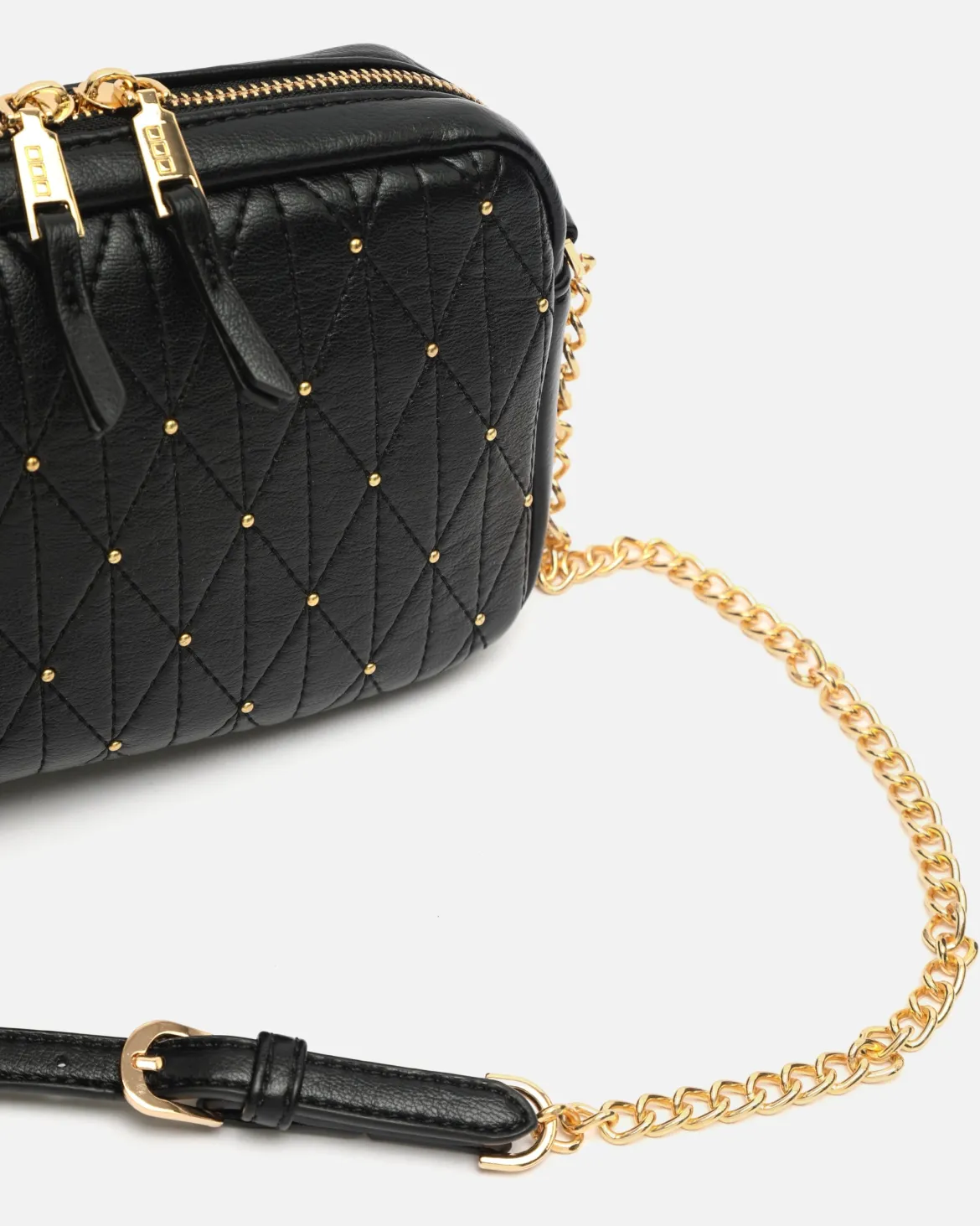 Bolso bandolera mini con detalles metálicos