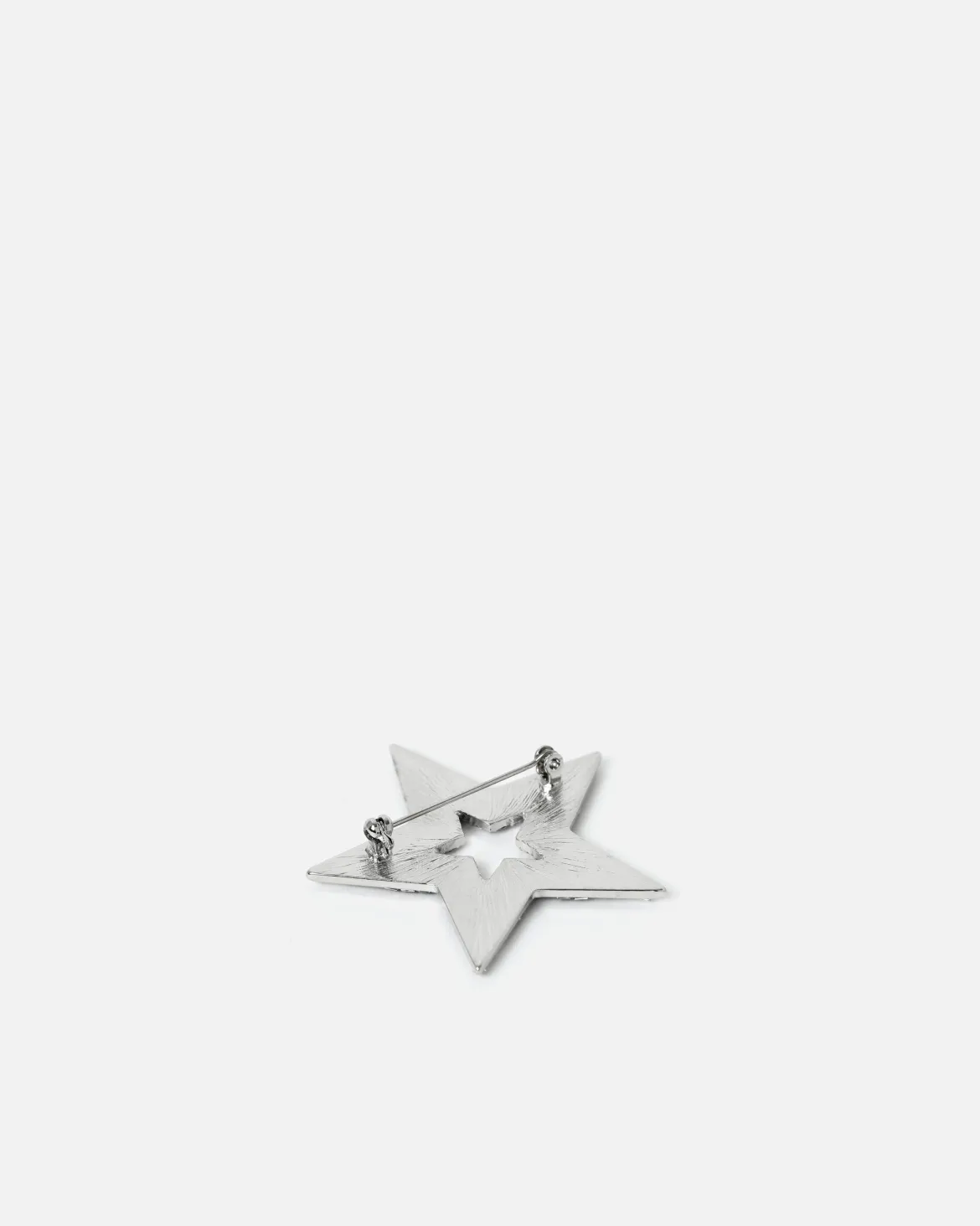 Broche en forma de estrella con detalles brillantes