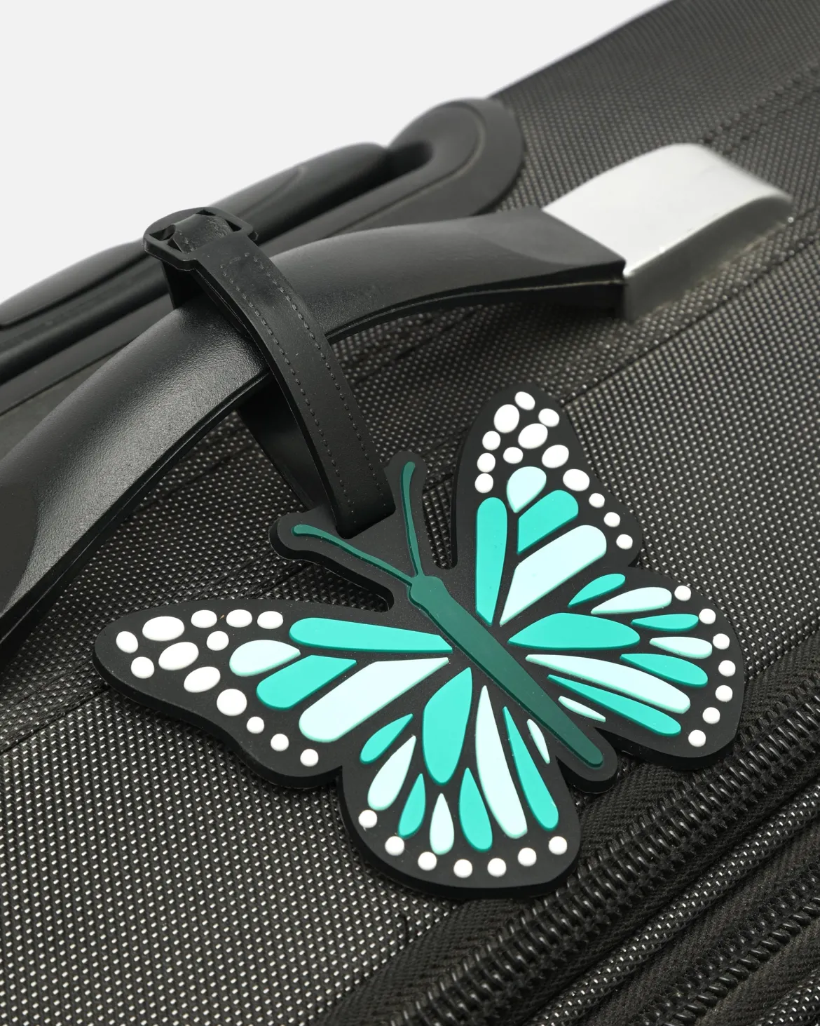 Identificador de equipaje en forma de mariposa